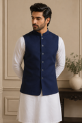 Model wearing Sualeheen navy blue classic waistcoat over white kurta pajama